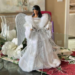 New in box Christmas tree light up angel tree topper.